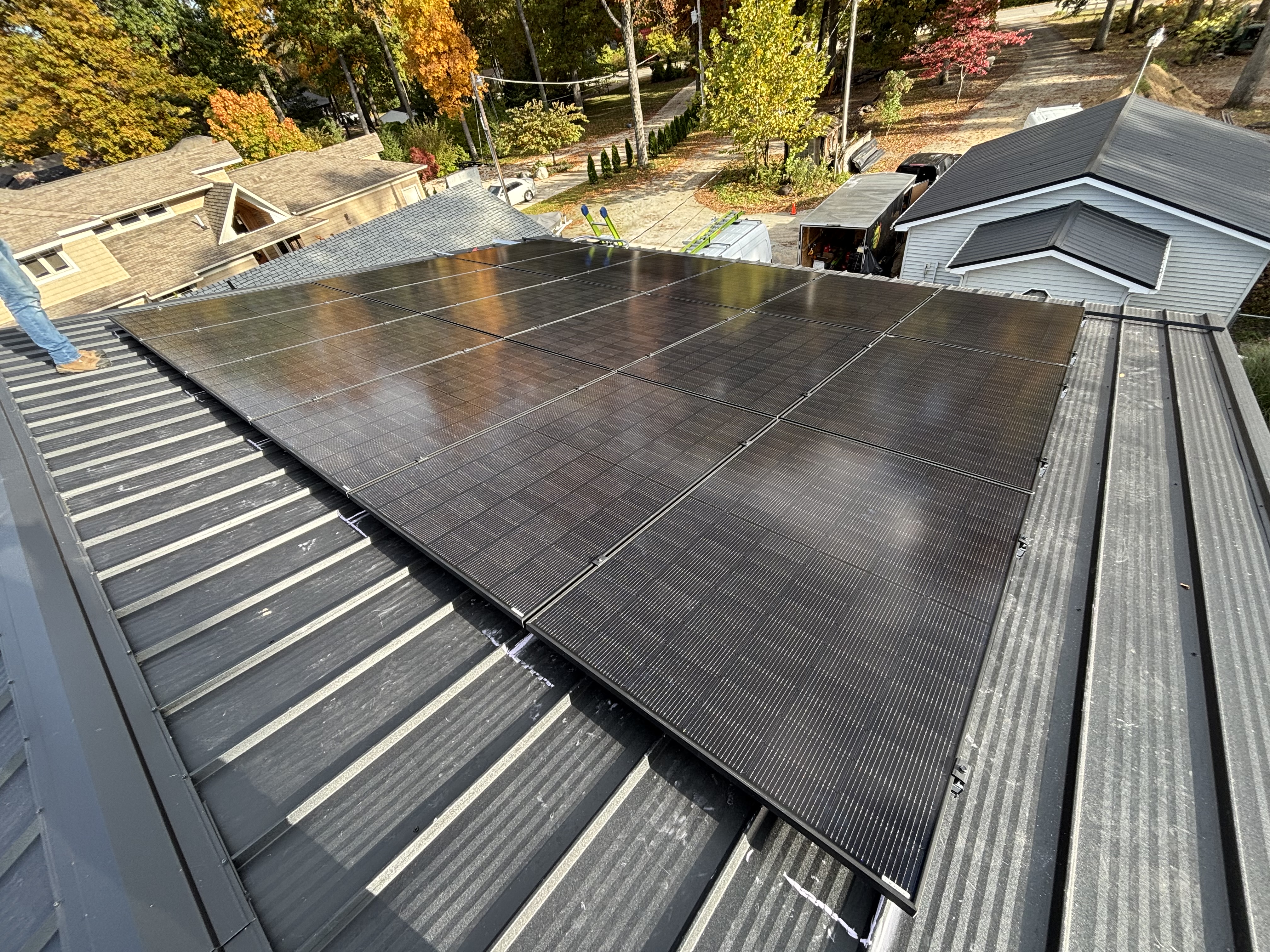 Close-up of a solar panel array on a residential metal roof