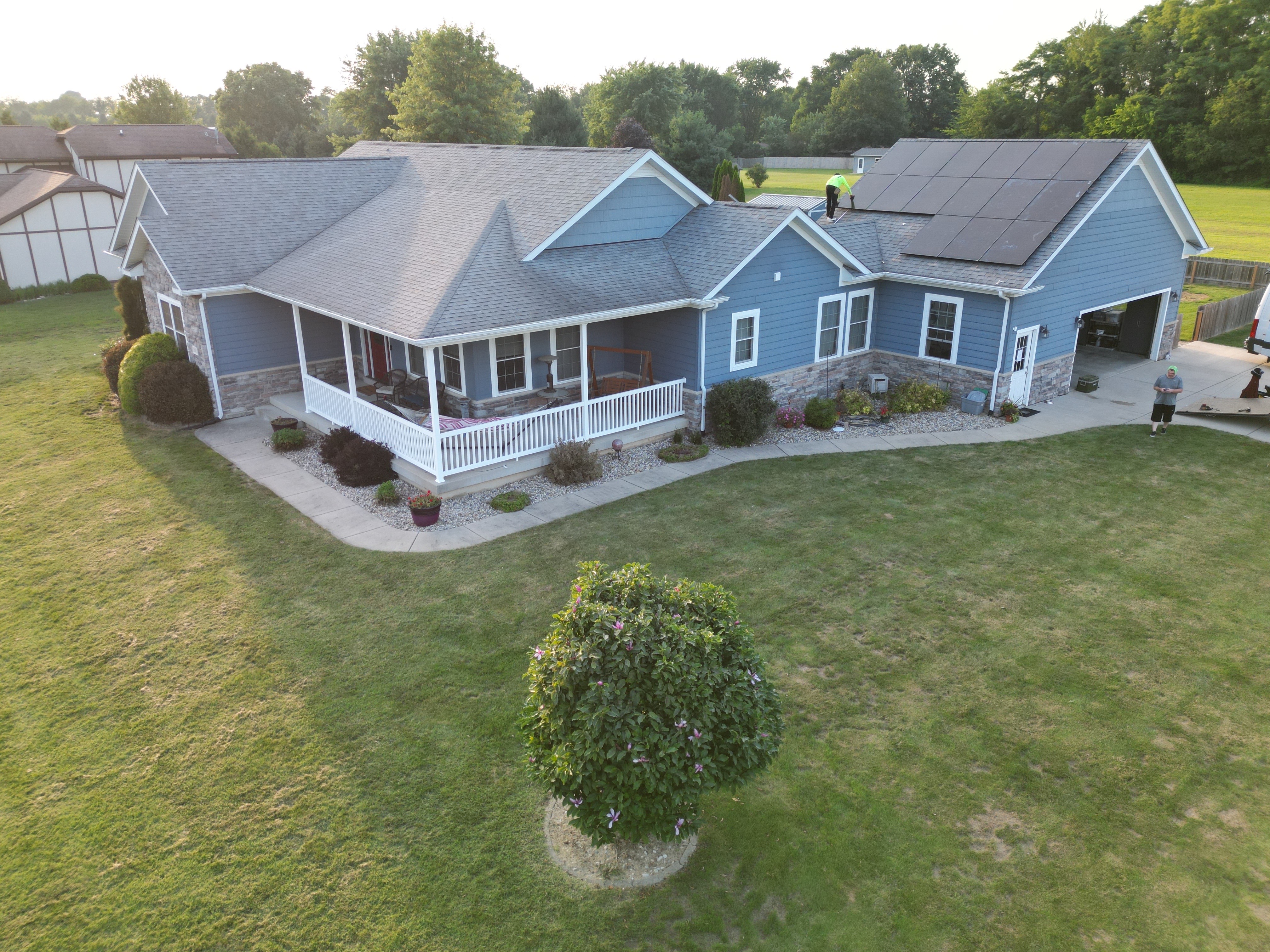 Cinematic aerial photo of solar panels on a residential roof